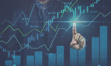 Businessman hand pointing growth graph increase. business growing successful financial. Finger up...