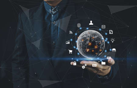 Businessman hand holding smart phone.Virtual digital technology concept,Social media , Digital Link, Big Data, Networking Concept, Everything is at hand.の写真素材