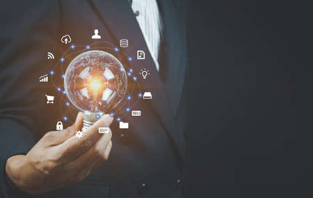 Man holding light bulbs, ideas of new ideas with innovative technology and creativity. concept...