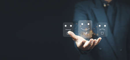 User give rating to service experience on online application, Customer review satisfaction feedback survey concept, Customer can evaluate quality of service leading to reputation ranking of business.の写真素材