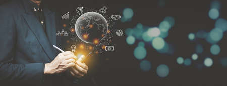 Businessman holding global internet connection technology business and digital marketing, finance...
