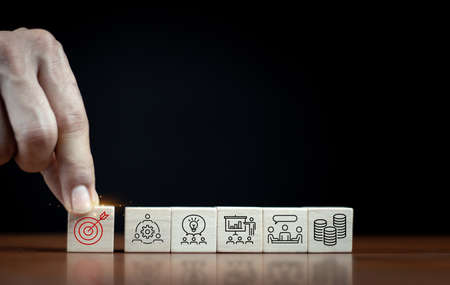 Goal board results printed on wooden cube blocks on ideas and funds icons, business information. To be creative and set up ideas, goals, business objectives.の写真素材