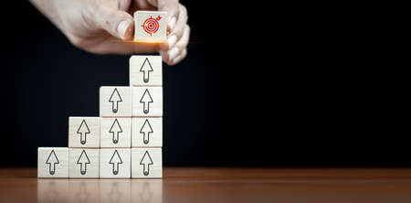 hand stack woods block step on table with icon Action plan, Goal and target, success and business...