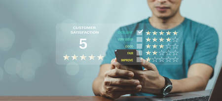 Customer review satisfaction feedback survey concept, User give rating to service experience on online application, Customer can evaluate quality of service leading to reputation ranking of business.の写真素材