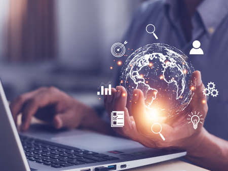 Man  holding virtual Global Internet connection metaverse. Business global internet connection application technology and digital marketing, Financial and banking, Digital link tech, big data.の写真素材