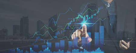 planning and strategy, Stock market, Business growth, progress or success concept. Hand of Businessman or trader touching showing a growing virtual hologram stock on smartphone, invest in trading.の写真素材