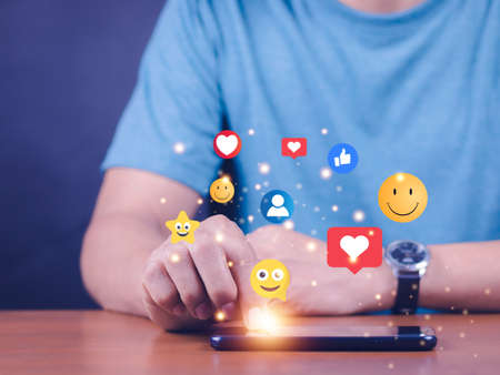 Social media and digital online concept, woman using smart phone on sofa at home. The concept of...
