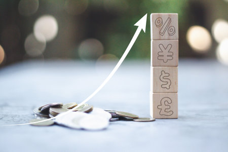Shining rise up arrow on wooden cube blocks with percentage icon on coin stacked, bar graph chart steps, investment, profit, benefit, income, banking, business growth, economic improvement concepts.の写真素材