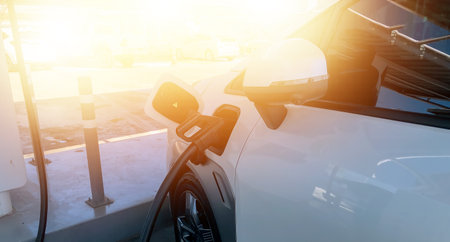 EV charging station for electric car in concept of green energy and eco power produced from sustainable source to supply to charger station in order to reduce CO2 emission .の写真素材
