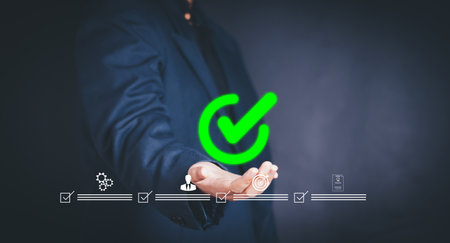 Quality control, Quality Assurance of Products and services. Hand shows the sign of the top service Quality assurance, Guarantee, Standards, ISO certification and standardization concept.の写真素材