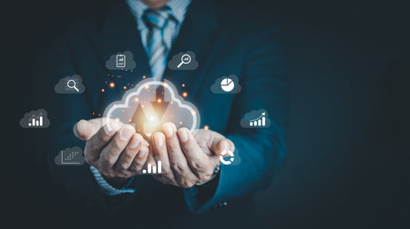 Businessman hand holding Cloud computing technology internet storage network. Cloud service, Cloud technology, and Cloud storage Concept.の写真素材