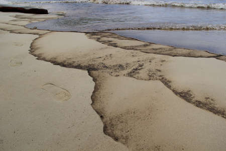 Accident from crude oil spill into Ao Prao Beach.