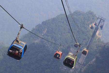 Chinas Tianmen Shan cable car is the longest cable car ride in the world, covering a distance of 7,455 meters. The car runs from Zhangjiajie downtown up to Tianmen Shan, which translates as "Heavens Gate Mountain."のeditorial素材