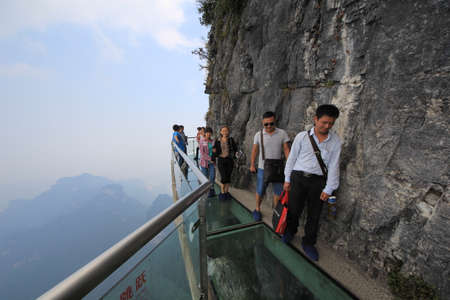 China - September 24,2013 : A Perfect Instrument to Terrify People ,Glass Bridge sky walk at Tianmenshan Tianmen Mountain China ,a UNESCO World Heritage Siteのeditorial素材