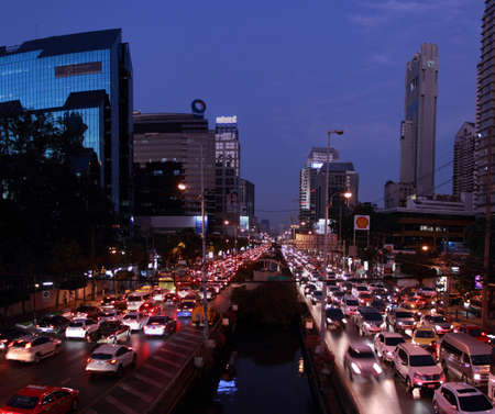 The rush hour traffic  and Bangkok skyline at dusk on Sathon Road ,the business district.のeditorial素材
