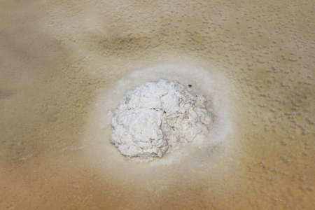 Sea Salt crystals laying in a messy pile ,Salt Evaporation Pond prepare for harvesting,Samut Sakhon Province, Thailandの写真素材