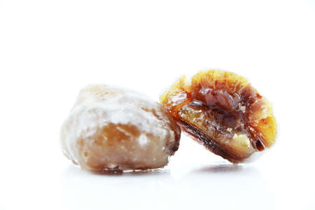 Marron glace or Candied Chestnuts Are A Classic Turkish Confection Isolated on a white backgroundの写真素材