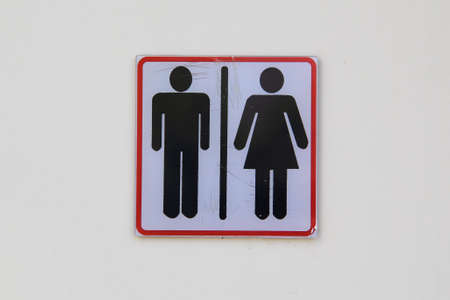 Men and woman toilet signs on a wallの写真素材
