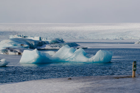 Icebergs floating in a cold blue sea