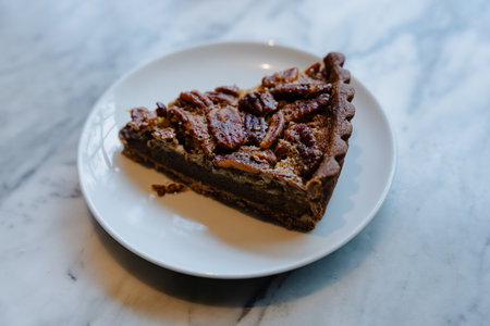 Slice of Pecan Pie on White Plateの写真素材