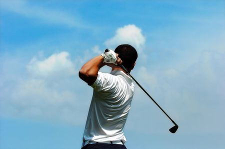 Golfer hit a ball in to the sky