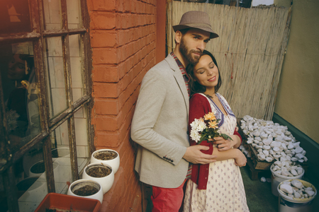 Couple in front of the red brick houseの写真素材