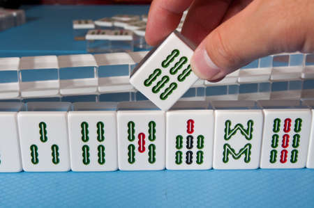 touch a nice mahjong tiles in a gameの写真素材