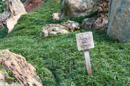 keep of the grass sign on grass with chinese wordsの写真素材