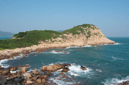 sea side with stone and a clear skyの写真素材