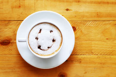 A cup of coffee white cup on woodenの写真素材