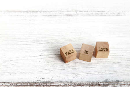 Three wooden cubes on wood.の写真素材