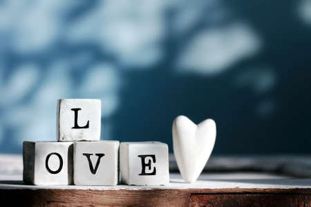 Four cubes with  LOVE word.の写真素材