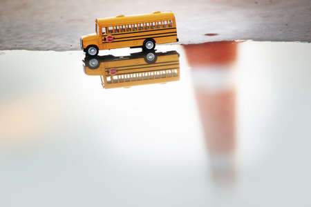 school bus toy model in closeup shot の写真素材