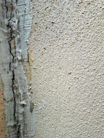 THE CRACK ON THE WALL. Cracks on the surface of the cement wallの写真素材