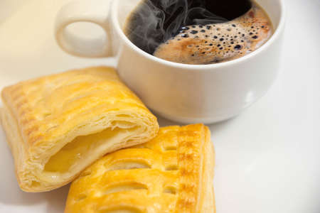 Fresh Coffee  in a cup white,Pineapple Pie  on white background.の写真素材