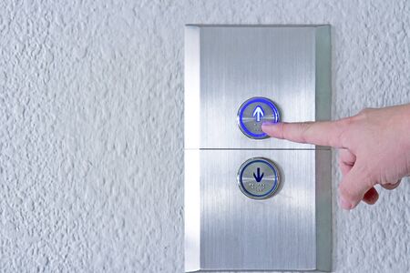 Using hands, press the elevator up and keypad elevator and bottom key