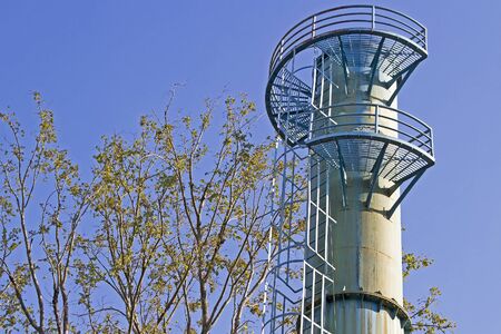 Water tower and blue sky  is near treeの写真素材