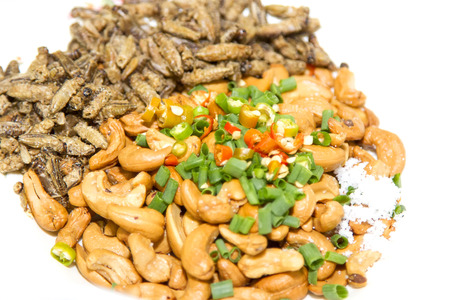 Mixed dried nuts and fried insects and salt and chilli is thai of local food