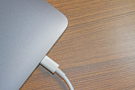 USB type-C port on  laptop and Cable's White of  laptopの写真素材