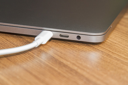 USB type-C port on  laptop and Cable's White of  laptopの写真素材