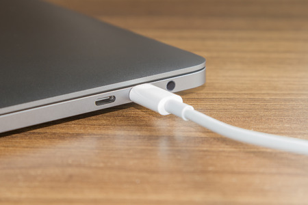 USB type-C port and Cable's White of laptopの写真素材