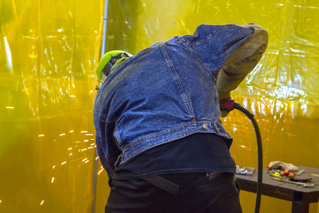 Man grinding iron of look from behindの写真素材