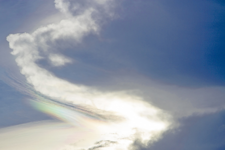Rainbow on the sky and clouds in the eveningの写真素材