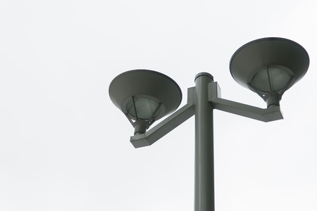 Light tower and black lamp with bright white background.の写真素材