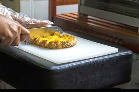 hands knife cutting of sliced bread bakery