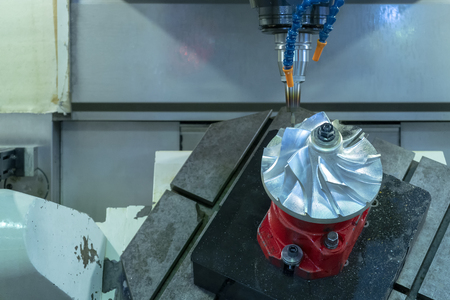 Five axis CNC machining center cutting jet engine turbine.の写真素材