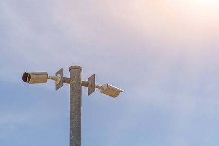 CCTV on the pole with blue sky backgroundの写真素材
