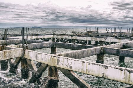 Pillars of cement in the sea.の写真素材