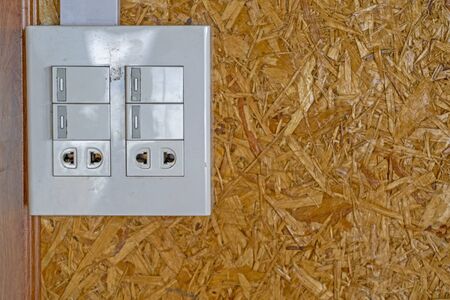 Light switch are on the wall woodの写真素材