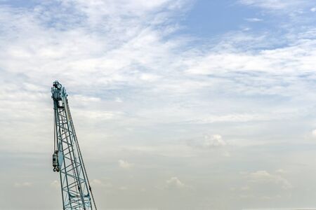 Crane lift of  green on blue sky backgroundの写真素材